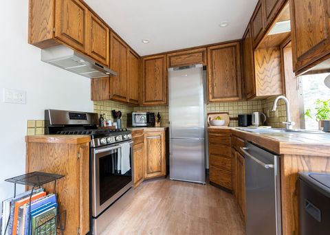 The small but mighty kitchen features all new countertop appliances, new cookware and a combination of Crate  & Barrel dinnerware (for 10) and vintage bowls and plates. 