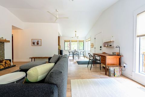A view of the great room featuring comfortable living, dining and work areas. 