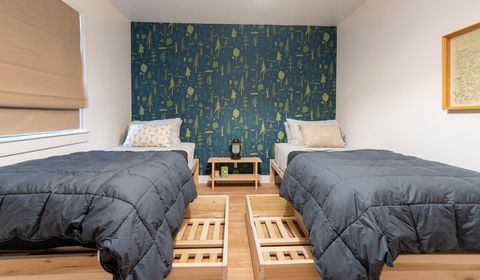 Each bed features two rolling storage containers.