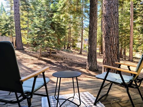 Enjoy morning coffee on the private side deck (the fenced-in yard is to the left in this photo). 