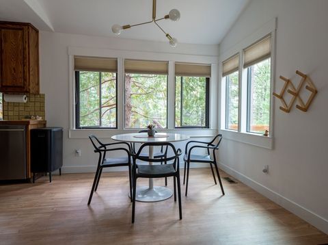 The dining area is set among the trees. 