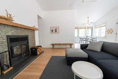 The fireplace is lovely as well as practical -- it's vented to heat the home, if needed. Wood piles are stacked indoors and outside for your convenience.