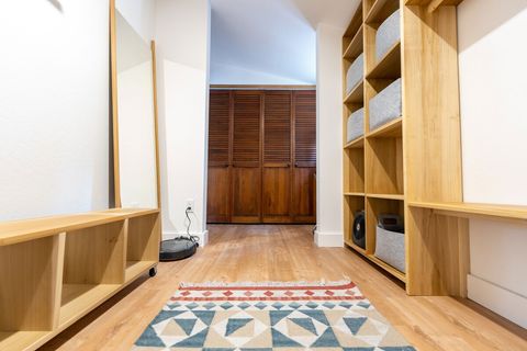 The closet also features a full-length mirror and exercise equipment, including a Yoga mat, blocks, foam roller and resistance bands.