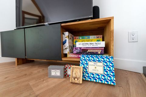 Snowed in? Catch up on the abundance of contemporary fiction and nonfiction books in the left-side cabinet, and games and puzzles on the right.
