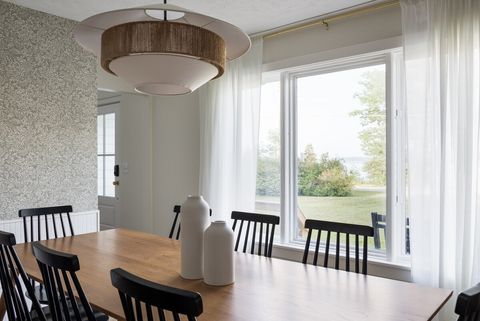 Dining room has large window overlooking the lake