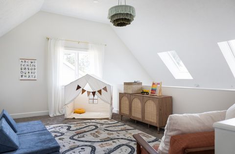 Loft playroom includes play tent, play couch, and lots of toys