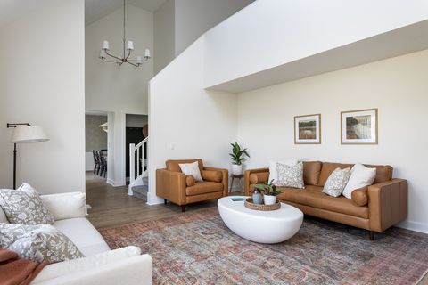 Living room has 2 couches and a chair to seat the whole group