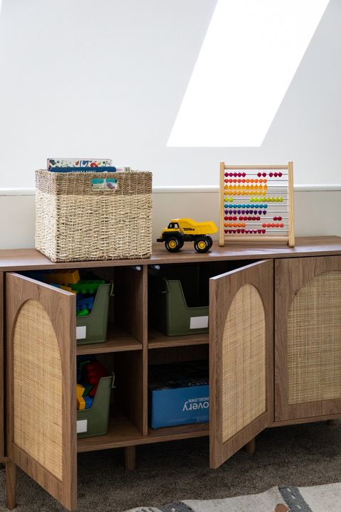 Toys and books in the playroom cabinets 
