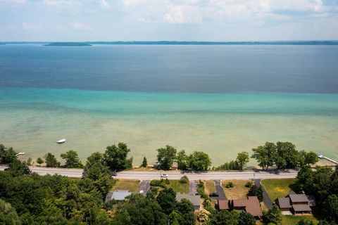 Property is located across M22 from the private lake access