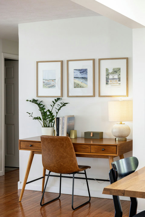 Bright mid-century workspace with desk, lamp, and stylish decor