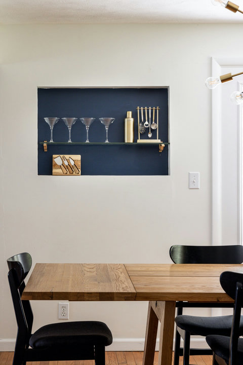Modern dining nook with stylish built-in bar display