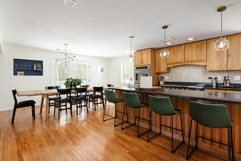 Bright open kitchen with island seating and spacious dining area