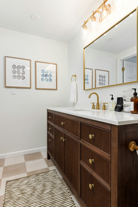Stylish spa-like bathroom with brass accents and a sleek double vanity look