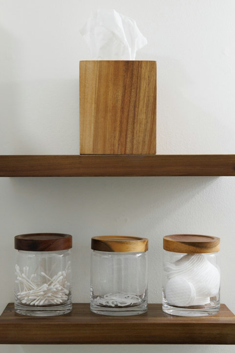 Spa-like bathroom essentials with stylish wood and glass storage