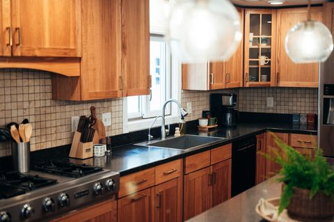 Full kitchen includes fridge, stove, oven, microwave, dishwasher, and warming drawer