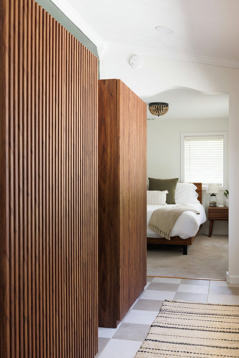 Warm timber details lead to a bright, serene bedroom retreat
