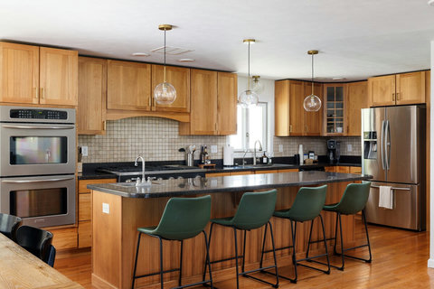 Spacious gourmet kitchen with island seating for four