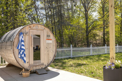 Private barrel sauna with peaceful backyard views and cozy outdoor charm