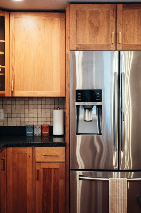 Dual door refrigerator with water and ice in door