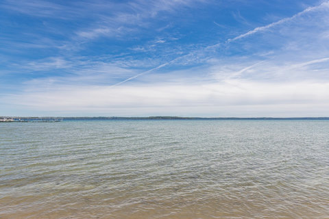 Peaceful waterfront views under bright open skies
