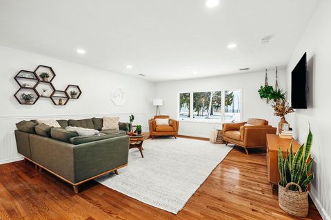 Great room has large window overlooking the lake