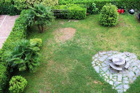 Common garden of the building where you can go relax and lay on the grass.