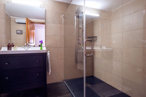 Suite bathroom with a massage shower