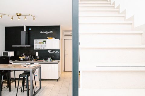 In the spacious open-plan kitchen and living room, you'll find air conditioning. Throughout the entire house, the floors are heated. To reach the sleeping area, simply take the stairs.