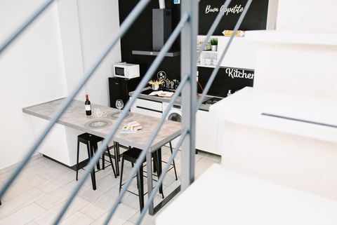 The kitchen is packed with everything you need: fridge, microwave, child-safe stove, washer-dryer, coffee maker, pots, pans, and plenty of dishware. An island provides a great space for family meals.