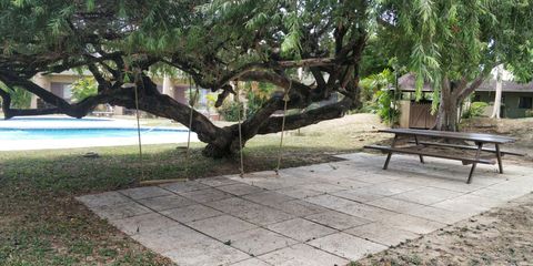 Outdoor seating  and picnic area by the pool