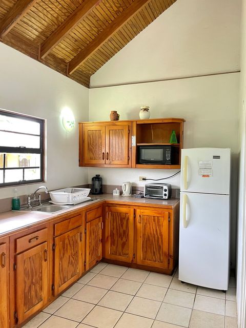 Fully equipped kitchen with opens through double doors onto large verandah perfect for dining with friends and family.