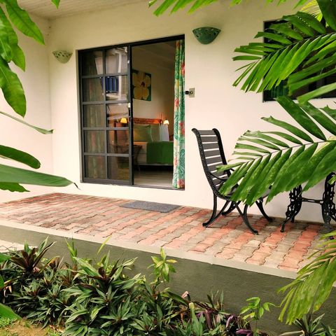 Rm 1 Outdoor seating with lush garden view