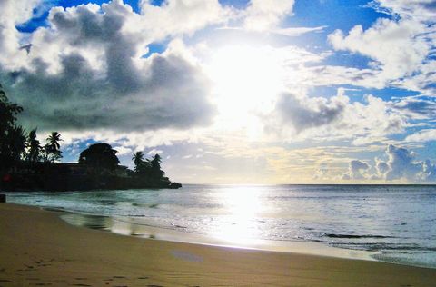Storebay Beach sunset...5 minutes walk from Bananaquit. Great way to end the day with a "Carib" beer