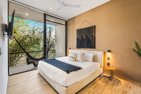 King Size Bedroom on 2nd Floor with Smart TV, AC, Ensuite Bathroom, Balcony Access and Private Back Patio