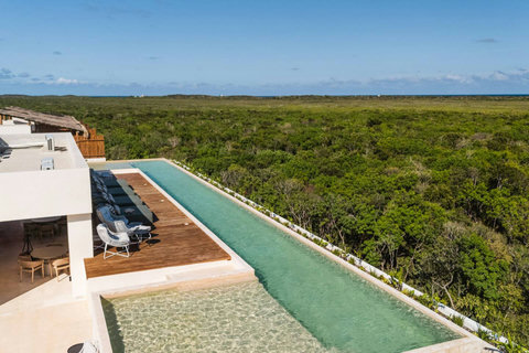 Lounge on the rooftop pool overlooking the National Jaguar Park