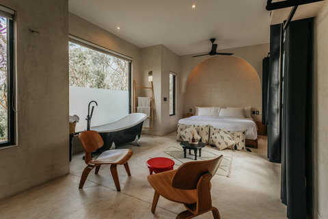 King size bedroom with private bath tub, privacy screen, blackouts and ensuite bathroom