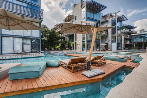 Lounge and relax in one of the many day beds around the lagoon pools