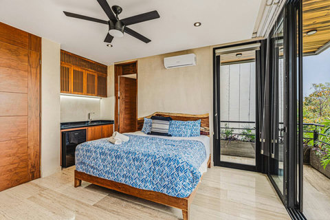 Kingsize Bedroom w Ensuite Bathroom, Private Balcony, Closet, Smart TV, Kitchenette, Mini Bar, Seating Area,Fan and AC