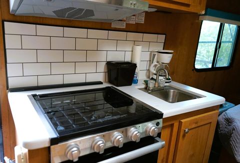 Kitchenette in each of four trailers has a stove, oven, microwave, sink, refrigerator, freezer.