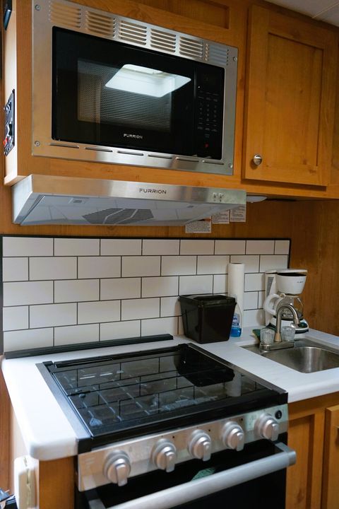 Kitchenette in each of four trailers has a stove, oven, microwave, sink, refrigerator, freezer.