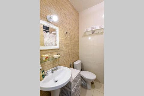 equiped bathroom with electric shower and hygienic shower