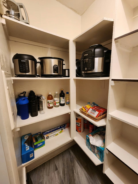 Pantry - Rice cooker, air fryer, crock pot, plastic bags, foil, plastic wrap, vinegars, oils.