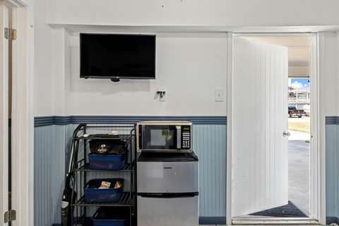 Downstairs TV, microwave, and mini-fridge.