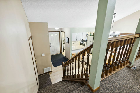 Upper floors leads to the living room, 2 bedrooms and main bathroom.
