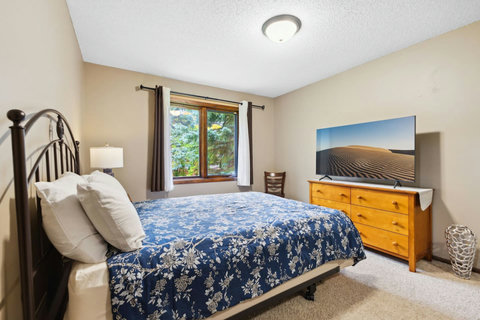 Bedroom # 2, Master bedroom, 1 queen bed, 55" TV and access to main bathroom.