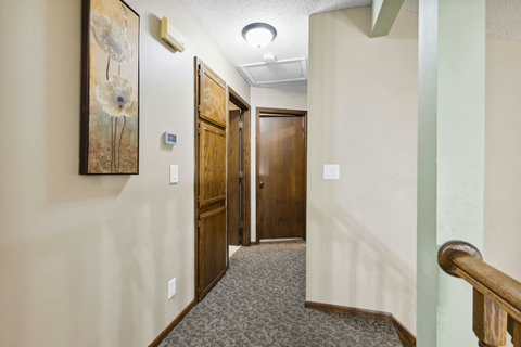 Hallways leads to 2 bedrooms and main bathroom.