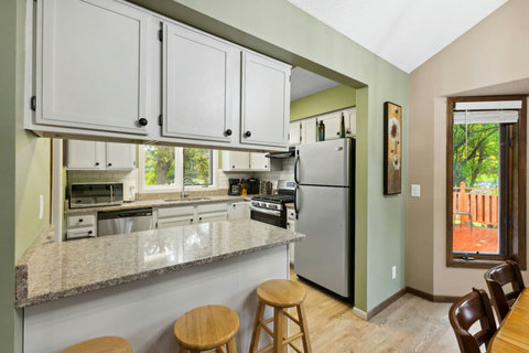 Granite countertops and stainless steel appliances.