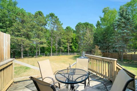 Deck overlooking fenced back yard