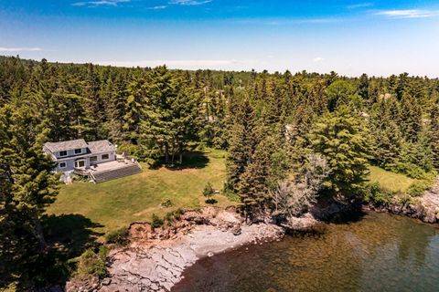 Lake Superior North Shore private cabin with 4 bedrooms and 2.5 bathrooms. Large family deck, and yard only 70 feet from the lake.