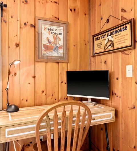 Office area with desk and computer monitor